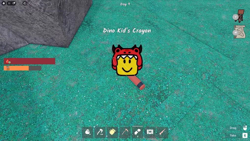 สีเทียนของ Dino Kid วางบนพื้นพร้อมป้าย Dino Kid’s Crayon