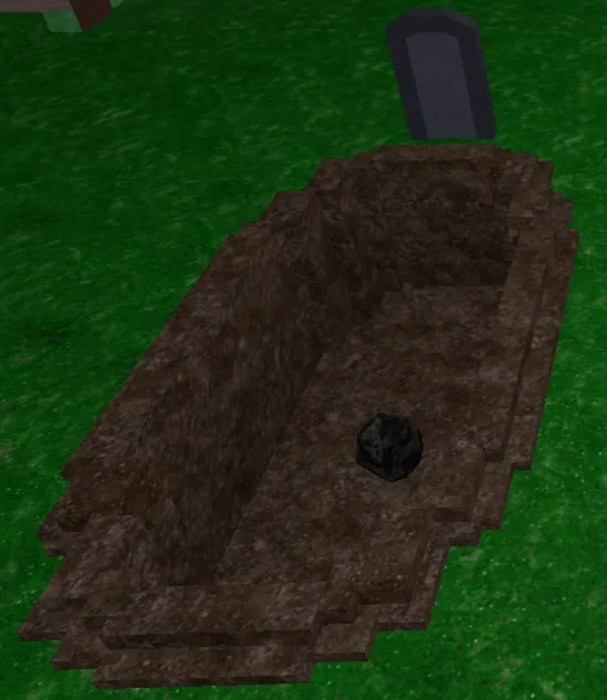 Grave แบบ Open Grave หลุมดินเปิดยาว มีป้ายหินและถ่านอยู่ด้านใน